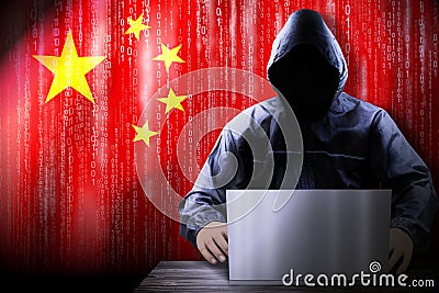 Anonymous hooded hacker, flag of China, binary code - cyber attack concept Stock Photo