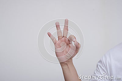 An anonymous male making the Ok or okay sign with his hand. on a white background Stock Photo