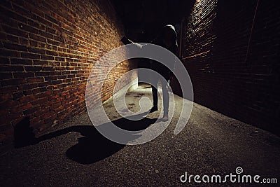 Anonymous maniac man fighting on dark night street. Robbery concept. Self-defence concept. Stock Photo