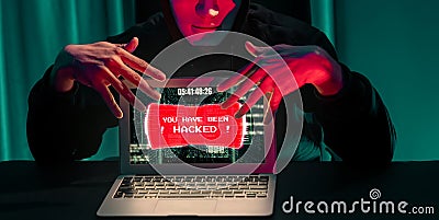 Anonymous mask successful making password encryption hack on laptop. Pecuniary. Stock Photo