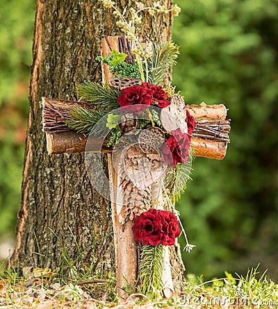 Anonymous urn grave with cross, forest cemetery Stock Photo