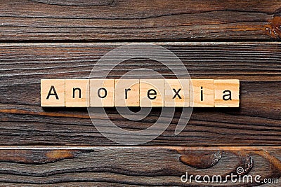 Anorexia word written on wood block. anorexia text on table, concept Stock Photo