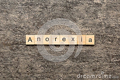 anorexia word written on wood block. anorexia text on table, concept Stock Photo