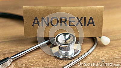 ANOREXIA word wrote on brown label with stethoscope Stock Photo