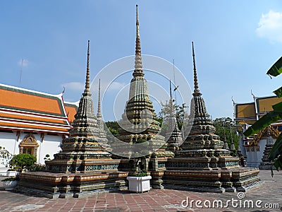Wat Pho Thai Massage School Service Center. Another attraction of Wat Pho. Chinese stone statues adorned by arches and places. Stock Photo