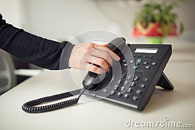 Answering phone call.Phone ringing.Good or bad news.Business failure.Customer service help center.Secretary answering phone Stock Photo