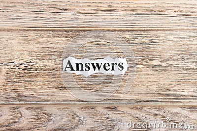 answers text on paper. Word answers on torn paper. Concept Image Stock Photo