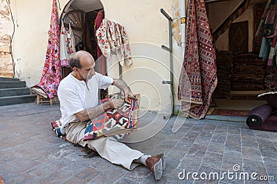 Turkish carpet master repearing old traditional turkish carpet Editorial Stock Photo