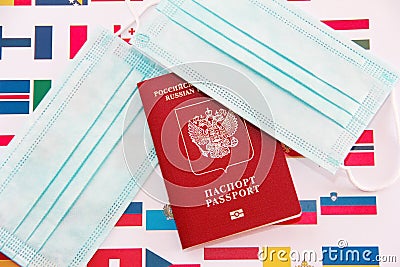 Antalya, Turkey, January 26, 2021. International Russian passport, medical masks and flags of European countries Editorial Stock Photo