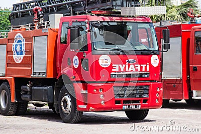Antalya, TURKEY - 17 MAY , 2018: Red firetruck with rescue ladder standing on the street of the city near firehouse Editorial Stock Photo