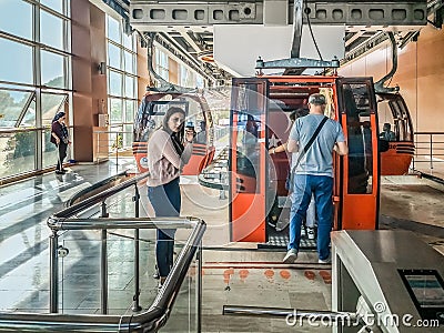 People enter the cabin of the Antalya Tunektepe Teleferik cable car Editorial Stock Photo