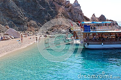 Antalya, Turkey - 15 Oktober 2020: People swimming at famous blue sea at Suluada Editorial Stock Photo
