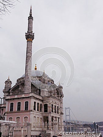 An old rarity Muslim eastern Turkish mosque with a minaret and a shiny yellow crescent Editorial Stock Photo