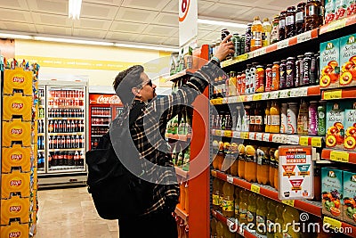 Antalya, Turkey 02 08 2023 Shopping food supermarket concept. Consumerism concept, junk food . Young smiling man Editorial Stock Photo