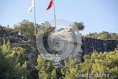 Antalya, Turkey - 03.07.2020: Statue of Mustafa Kemal Ataturk and an artificial waterfall, at the entrance to the city forest, an Editorial Stock Photo