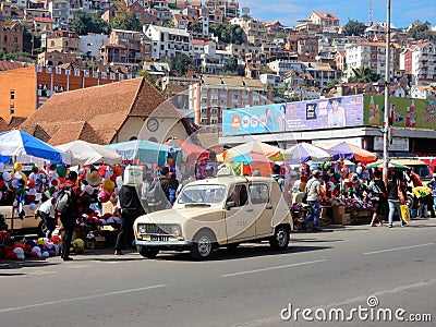 Madagascar, Antananarivo, Colorful market stalls, oldtimer car, houses Editorial Stock Photo