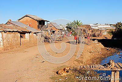 Madagascar, Antananarivo suburb with clay houses and sand road Editorial Stock Photo