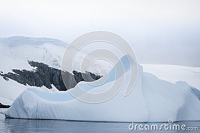 Antarctic glacier in the snow. Beautiful winter background. Stock Photo