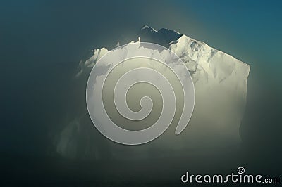 Antarctic iceberg in morning mists Stock Photo