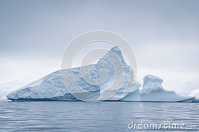 Antarctic icebergs and majestic landscape, cloudy blue sky Stock Photo