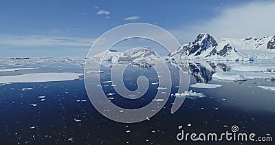 Antarctic seascape at glacier coast aerial. Icebergs floating at arctic ocean bay. Melting ice, snow Stock Photo