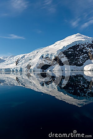 Antarctic seascape with icebergs and reflection Stock Photo