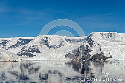 Antarctic seascape with icebergs and reflection Stock Photo