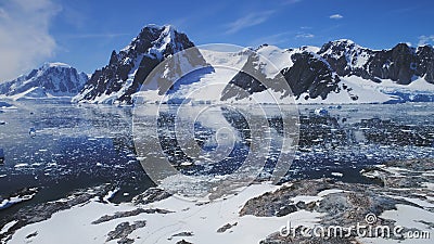 Antarctica ocean, snow mounts. Aerial flight. Stock Photo