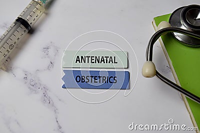 Antenatal Obstetrics text on Sticky Notes. Top view isolated on office background. Healthcare/Medical concept Stock Photo