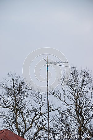 Antenna analog on the mast for receiving a radio signal Stock Photo