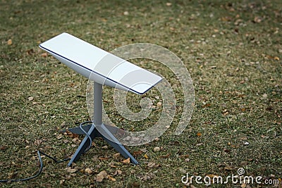 An antenna for receiving the Internet signal from space Starlink Stock Photo