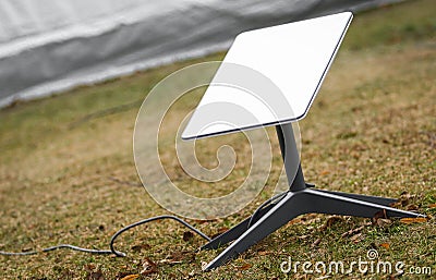 An antenna for receiving the Internet signal from space Starlink Stock Photo