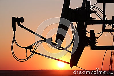 Antennas at sunset. Telecommunications Stock Photo