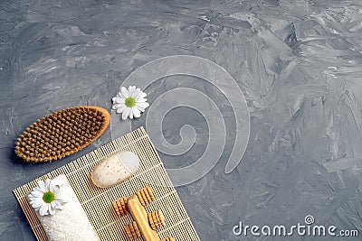 Anti cellulite massage accessories and spa beauty cosmetic products on grey stone background from above. Flat lay, top view, Stock Photo