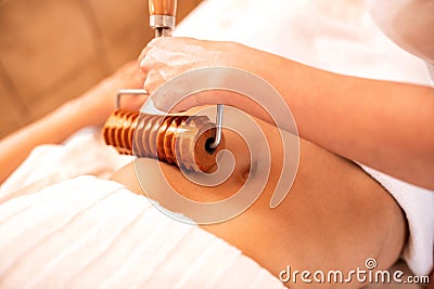 Anti-cellulite treatment with wooden instruments and tools Stock Photo