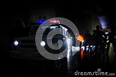 Anti-riot police give signal to be ready. Government power concept. Police in action. Smoke on a dark background with lights. Blue Stock Photo