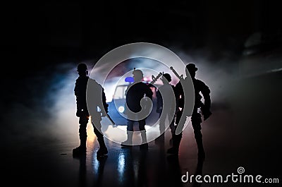 Anti-riot police give signal to be ready. Government power concept. Police in action. Smoke on a dark background with lights. Blue Stock Photo