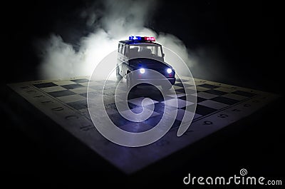 Anti-riot police give signal to be ready. Government power concept. Police on chessboard. Smoke on a dark background with lights. Stock Photo