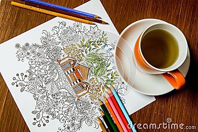 Anti-stress coloring book in the drawing process Stock Photo