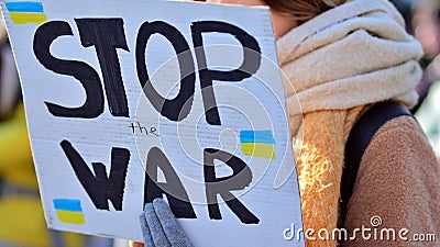 Anti-war protest outside Russian embassy in Warsaw. Demonstrators call for peace and condemn Putin. Editorial Stock Photo