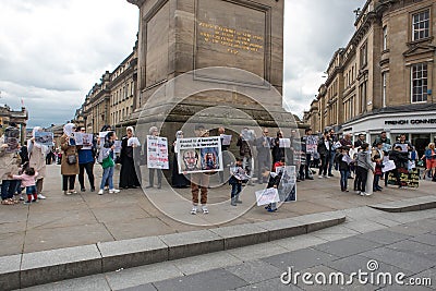 Anti war in Syria protest by men women and children holding banners and placards. Anti Assad, Anti Putin. Peaceful protest Editorial Stock Photo