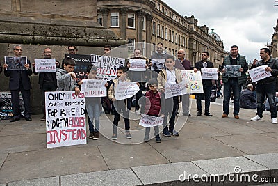 Anti war in Syria protest by men women and children holding banners and placards. Anti Assad, Anti Putin. Peaceful protest Editorial Stock Photo