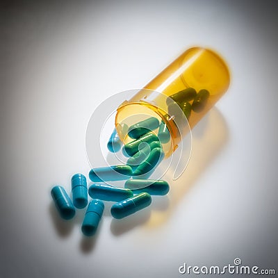 Pharmaceutical pills pouring out of a bottle Stock Photo