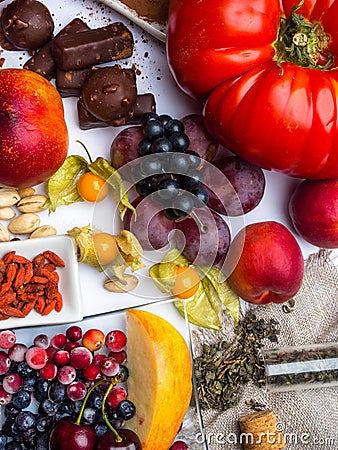 Antioxidants, resveratrol food as green tea, grape, blueberry, apricot, apple, cocoa, tomatoes, pomegranate, physalis, dark Stock Photo