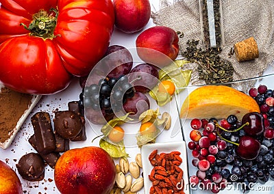 Antioxidants, resveratrol food as green tea, grape, blueberry, apricot, apple, cocoa, tomatoes, pomegranate, physalis, dark Stock Photo