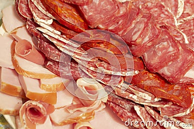 Antipasti composition of italian cured meat types. Salami, ham and dry sausage slices, closeup. Food background, texture Stock Photo