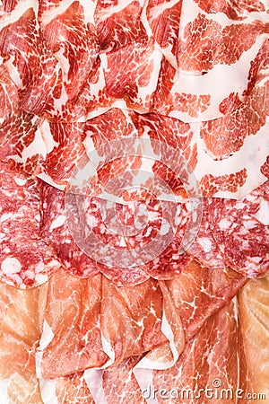 Antipasti composition of italian cured meat types. Stock Photo