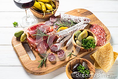 Antipasto delicatessen - meat, cheese and wine. Stock Photo