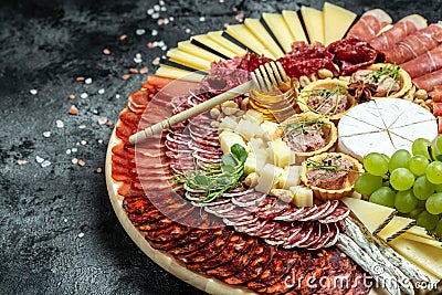 Antipasto platter jamon, prosciutto, ham, beef jerky, salami and cheese platter. Appetizer, catering food concept. place for text Stock Photo