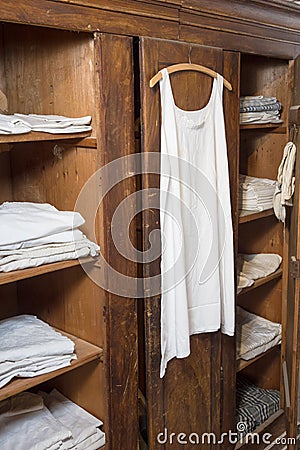 Antiquated bedroom with linen clothing Stock Photo